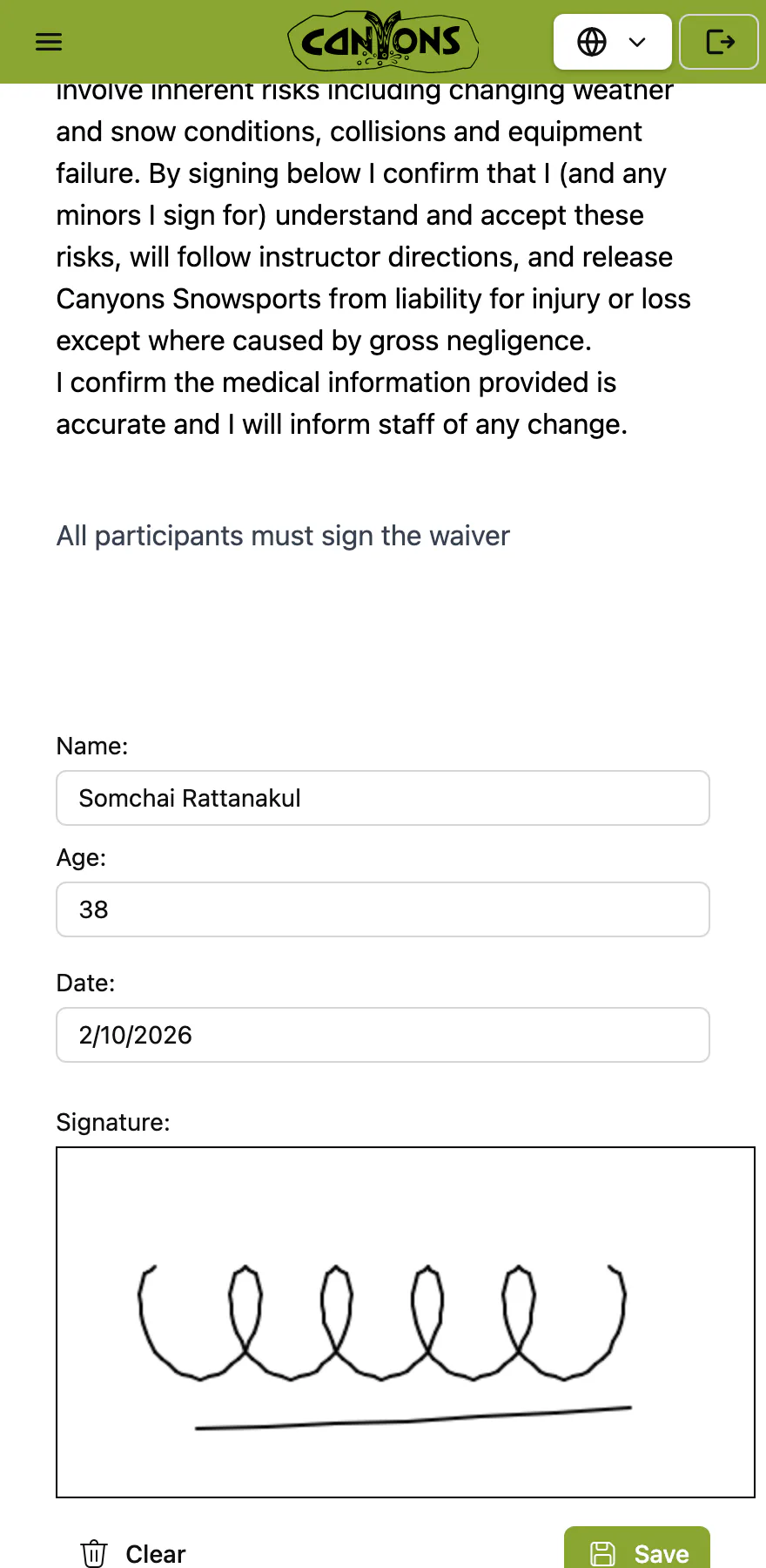 A waiver open on a guest’s phone: the terms, then the guest’s name, age and date, and their signature on the pad.